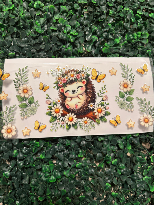 Hedgehog with daisies and butterflies