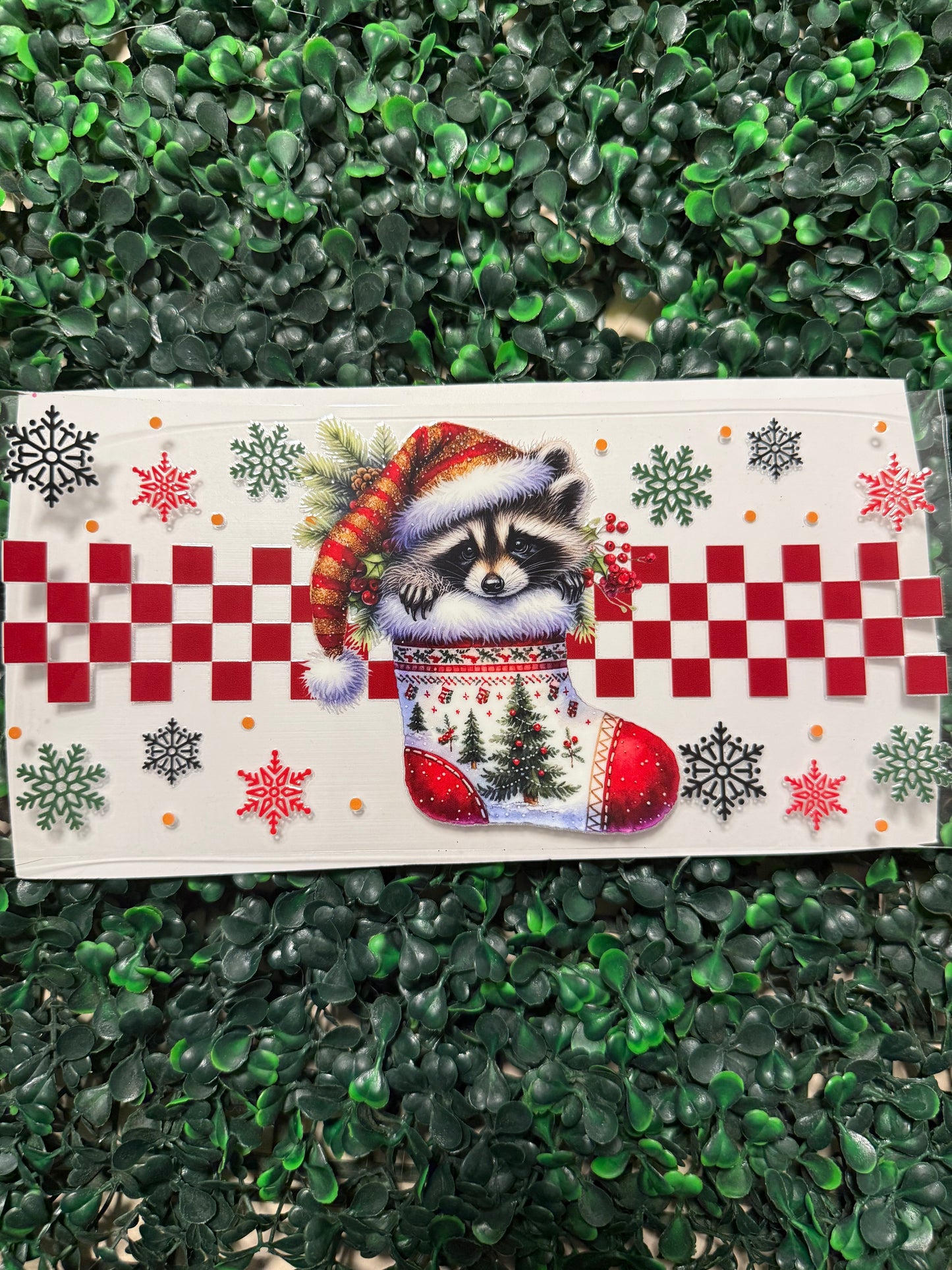 Christmas racoon with a Santa hat