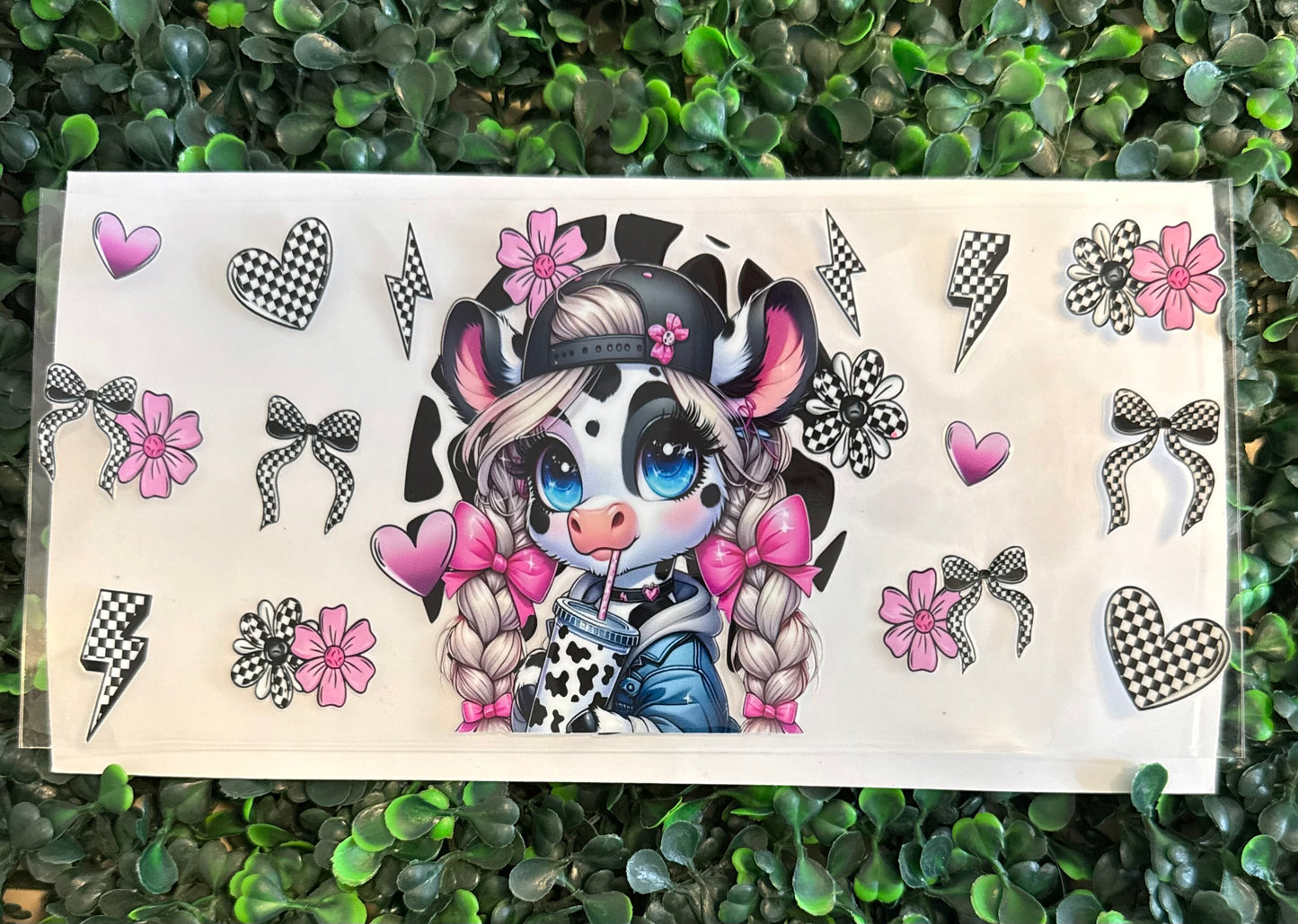 Black and white cow with bows