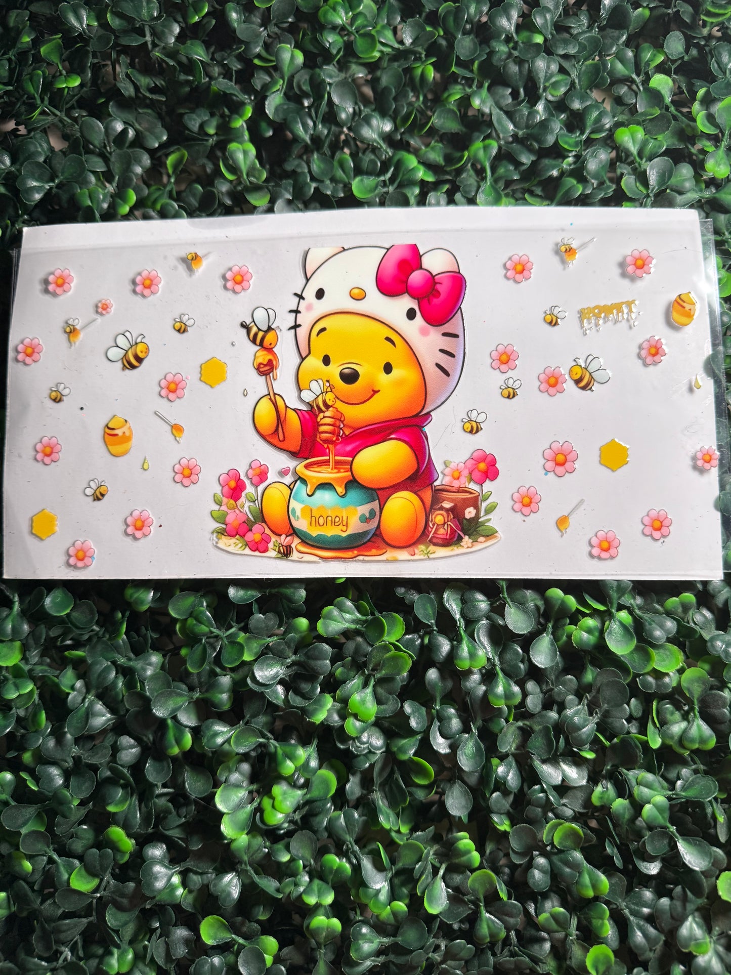 Pooh with a hello kit hat