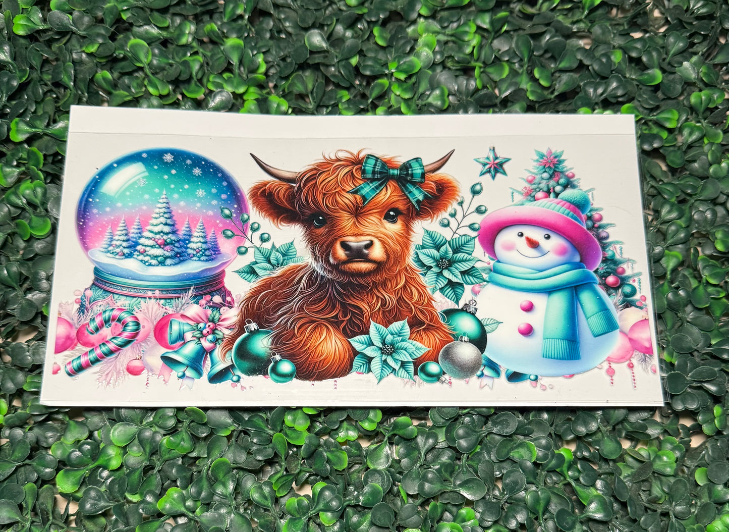 Christmas cow snow globe