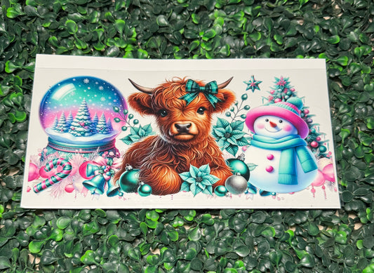 Christmas cow snow globe