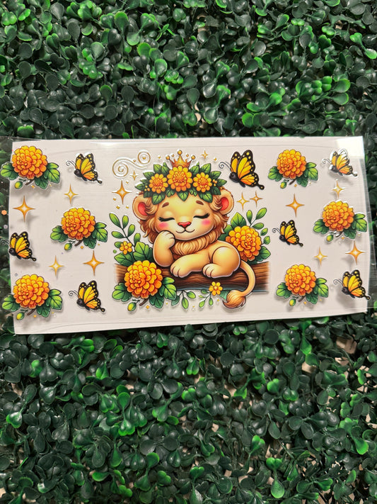 Sleepy lion with yellow flowers and butterflies