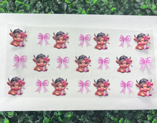 Highland cows with bows