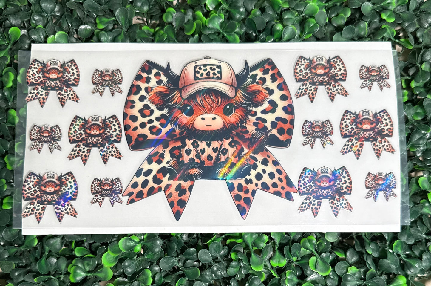 Holographic cheetah print bow and cows￼￼