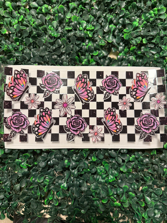 Pink and purple butterflies and roses over checker print